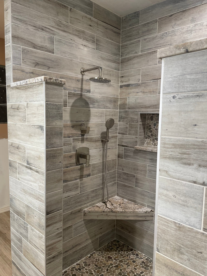 Tiled shower with corner seat and shower head