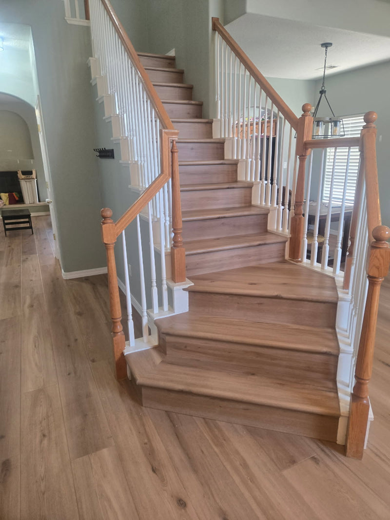 Wooden staircase with balusters in a home interior setting