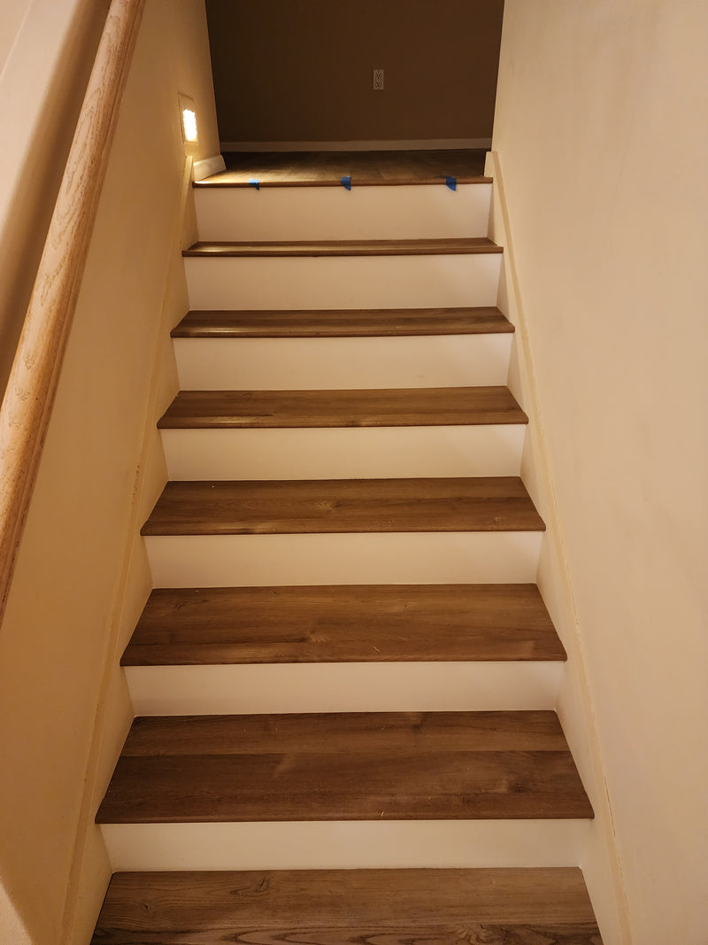 luxury vinyl plank stairs with white risers